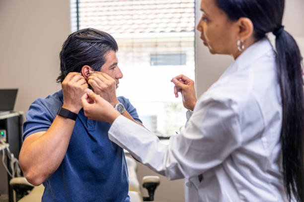 A hispanic male in his early 40s at a doctors appointment